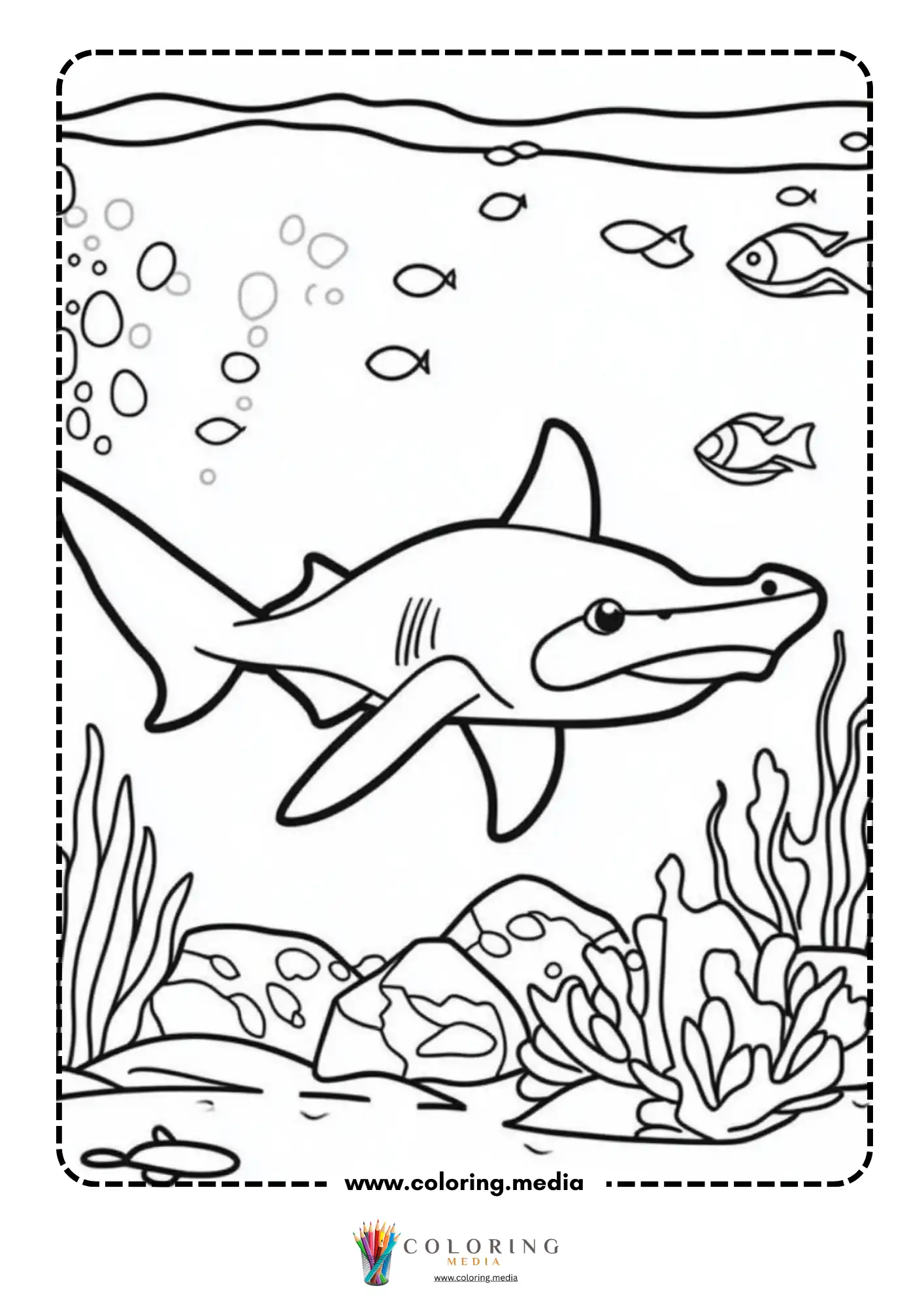 Hammerhead shark swimming over coral reef with small fish